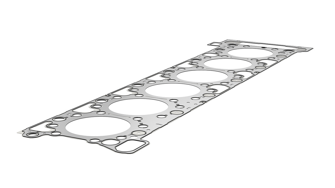 Metal-elastomer cylinder-head gaskets are made from metal carriers with vulcanized elastomer profiles. The basis for the outstanding performance is the specific distribution of sealing pressure in the area of the engine block/cylinder head.